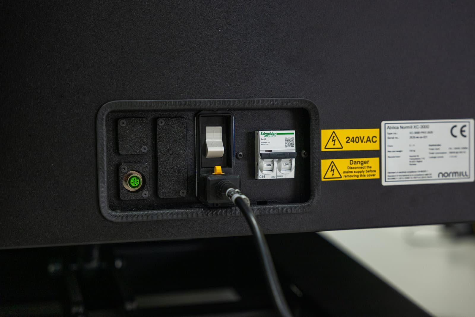Electrical panel with a Schneider C16 circuit breaker, a 240V AC warning label and the CE type plate.